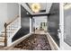 Stunning foyer featuring dark walls, hardwood floors, a modern light fixture, and an open view to the living area at 229 Celestial Blvd, Summerville, SC 29486