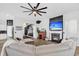 Comfortable living room featuring a fireplace, mounted TV, large sectional sofa, and open access to the entry hall at 229 Celestial Blvd, Summerville, SC 29486