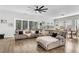 Bright living room with a large sectional sofa, hardwood floors, and an abundance of natural light at 229 Celestial Blvd, Summerville, SC 29486
