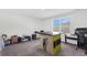 Spacious room with a large window and a versatile table for various activities and organization at 229 Celestial Blvd, Summerville, SC 29486