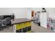 Bright room offers ample storage with shelving and rolling containers, perfect for an office or craft space at 229 Celestial Blvd, Summerville, SC 29486