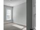 This bedroom features neutral colored carpet and walls, white trim, and a window at 2345 Primus Rd, Mount Pleasant, SC 29466