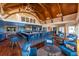 A clubhouse bar featuring high ceilings, detailed woodwork, a variety of seating, and a relaxing atmosphere at 2413 High Hammock Rd, Seabrook Island, SC 29455