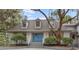 Charming gray two-story home with a welcoming blue front door and lush landscaping at 2413 High Hammock Rd, Seabrook Island, SC 29455