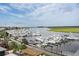 Picturesque marina with numerous boats docked along the waterfront under a bright sky at 2413 High Hammock Rd, Seabrook Island, SC 29455