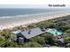 Picturesque aerial view highlighting the Sandcastle's proximity to the beach and pool at 2473 Shipwatch Rd, Kiawah Island, SC 29455