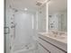 Modern bathroom featuring white tile, glass shower, and sleek vanity at 2473 Shipwatch Rd, Kiawah Island, SC 29455
