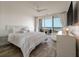 Bright and airy bedroom with a luxurious bed, stunning ocean view, and modern furnishings at 2473 Shipwatch Rd, Kiawah Island, SC 29455