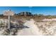 Exterior view of a low-rise building with the signage for a private boardwalk access point at 2473 Shipwatch Rd, Kiawah Island, SC 29455
