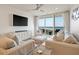 Stylish living room with a flat-screen TV, and ocean view at 2473 Shipwatch Rd, Kiawah Island, SC 29455