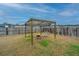 Back yard features a covered swing set and fire pit, perfect for relaxation at 252 Swamp Creek Ln, Moncks Corner, SC 29461