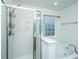 Bright bathroom showcasing a shower, tub, and window with privacy glass at 252 Swamp Creek Ln, Moncks Corner, SC 29461