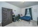 Bedroom featuring a twin bed, desk, and closet for storage at 252 Swamp Creek Ln, Moncks Corner, SC 29461