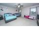 Large bedroom with a ceiling fan, two beds, a window, and a light pink wall at 252 Swamp Creek Ln, Moncks Corner, SC 29461