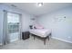 Cozy bedroom with a twin bed, large window, and carpet flooring at 252 Swamp Creek Ln, Moncks Corner, SC 29461