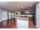 Open-concept kitchen with stainless steel appliances, granite countertops, and dark wood cabinetry at 252 Swamp Creek Ln, Moncks Corner, SC 29461