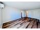 A bedroom showcasing sleek hardwood floors and neutral walls, complete with multiple closets and doorways at 259 E Bay St # 1 C, Charleston, SC 29401