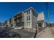 A view of the building showcasing its multi-story design and exterior architecture under a clear blue sky at 259 E Bay St # 1 C, Charleston, SC 29401