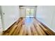 A bright and airy living room featuring modern wood floors and sliding glass doors to a private outdoor balcony at 259 E Bay St # 1 C, Charleston, SC 29401