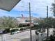 Exterior shot from a balcony overlooking a city street and ocean liner on a sunny day at 259 E Bay St # 1 C, Charleston, SC 29401