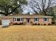 Charming brick home with well-manicured lawn and blue shutters at 2652 Elissa Dr, Charleston, SC 29414