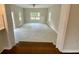 Bright living room features neutral paint, large windows, and tile flooring at 2652 Elissa Dr, Charleston, SC 29414