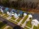 Aerial view of a residential home with a detached garage surrounded by well-maintained landscaping at 2710 Mcfadden Way, Johns Island, SC 29455