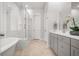 Bright bathroom featuring a glass-enclosed shower, free-standing tub, and double vanity at 2710 Mcfadden Way, Johns Island, SC 29455