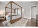 Serene main bedroom with a four-poster bed, rug, and hardwood floors at 2710 Mcfadden Way, Johns Island, SC 29455