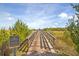 Wooden bridge leading to a natural area; the community sign denotes this is a covenants-restricted community at 2710 Mcfadden Way, Johns Island, SC 29455