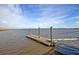 A private boat dock sits on the water, with a ramp providing easy boat access at 2710 Mcfadden Way, Johns Island, SC 29455