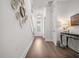 Inviting entryway with hardwood floors, decorative wall plates, and a staircase at 2710 Mcfadden Way, Johns Island, SC 29455