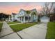 Charming two-story home with a welcoming front porch, and manicured lawn at 2710 Mcfadden Way, Johns Island, SC 29455