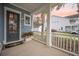 Charming front porch with a white railing and manicured landscaping, creating a warm and inviting entrance at 2710 Mcfadden Way, Johns Island, SC 29455