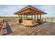 Open gazebo at end of pier provides shaded seating, perfect for enjoying waterfront views at 2710 Mcfadden Way, Johns Island, SC 29455