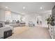 Spacious living room with modern furniture, a large area rug, and plenty of natural light at 2710 Mcfadden Way, Johns Island, SC 29455