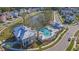 Aerial view of a community pool with lounge chairs, a covered area, and well-manicured landscaping at 2710 Mcfadden Way, Johns Island, SC 29455