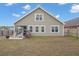 The exterior features a backyard view of the home, showcasing a screened patio and lawn at 319 Knawl Rd, Moncks Corner, SC 29461