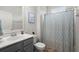 Clean bathroom featuring a shower with decorative curtain, vanity and faucet at 319 Knawl Rd, Moncks Corner, SC 29461