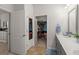 Bright bathroom featuring double vanity and open access to walk-in closet at 319 Knawl Rd, Moncks Corner, SC 29461
