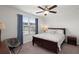 Inviting bedroom with hardwood bed frame, ceiling fan, and natural light from a window at 319 Knawl Rd, Moncks Corner, SC 29461