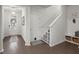 Bright entryway featuring a wooden front door, coat rack, and hardwood floors at 319 Knawl Rd, Moncks Corner, SC 29461