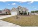 Charming single-Gathering home with a two-car garage, manicured lawn, and neutral colored siding at 319 Knawl Rd, Moncks Corner, SC 29461
