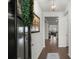 View from the foyer of the hardwood floors, a glimpse of the living room, and overall house layout at 319 Knawl Rd, Moncks Corner, SC 29461