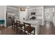 Open concept kitchen with stainless appliances, granite counters, gray cabinets, and a large island with seating at 319 Knawl Rd, Moncks Corner, SC 29461