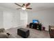 Cozy living area features a ceiling fan, a TV and storage, with plush carpet at 319 Knawl Rd, Moncks Corner, SC 29461