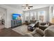 Bright living room features modern furniture, neutral paint, and hardwood floors at 319 Knawl Rd, Moncks Corner, SC 29461