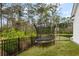 Backyard features a trampoline with safety net, providing outdoor fun in a secure environment at 3563 Bayden Bridge Ln, Mount Pleasant, SC 29466