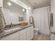 Well-lit bathroom with granite countertops, modern fixtures, and framed artwork on the walls at 3563 Bayden Bridge Ln, Mount Pleasant, SC 29466