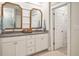 Bright bathroom featuring a double vanity with granite countertop, modern fixtures, and framed mirrors at 3563 Bayden Bridge Ln, Mount Pleasant, SC 29466